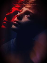 Multiple image of boy against black background