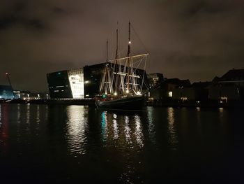 View of illuminated ship moored at harbor
