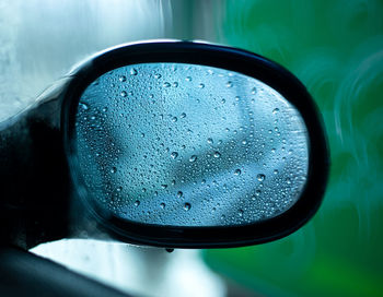 Reflection of road on side-view mirror