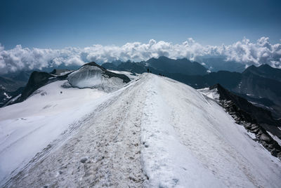 Snow covered mountains against sky