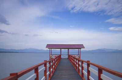 Pier over sea against sky