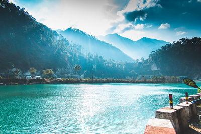 View of swimming pool with mountain range in background