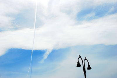 Low angle view of street light against sky