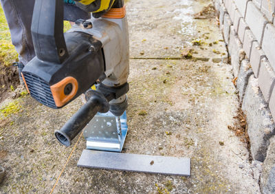 Low section of man working on street