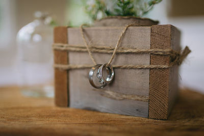 Wedding rings on top of wood round