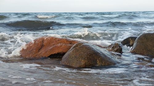 Waves splashing on rocks at shore