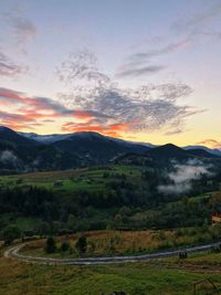 Scenic view of landscape against sky during sunset