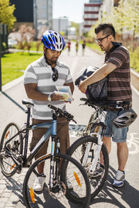 Two cyclists with map