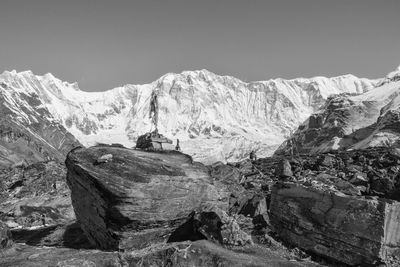 Scenic view of snowcapped mountains against clear sky