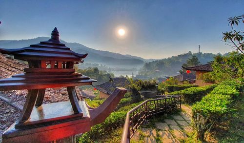 Panoramic view of temple and building against sky