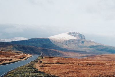 Scenic view of landscape and mountains against sky