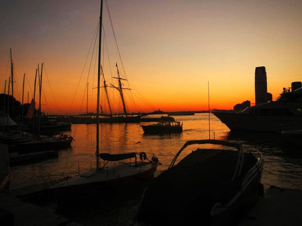 sunset, nautical vessel, water, boat, transportation, mode of transport, moored, orange color, sea, silhouette, beauty in nature, scenics, sun, tranquil scene, sailboat, tranquility, mast, sky, nature, harbor