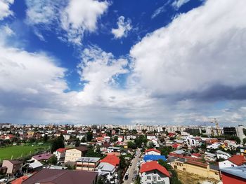 High angle view of town against cloudy sky