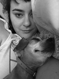 Portrait of a smiling young man with dog