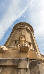 Low angle view of statue against sky