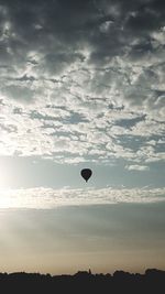 Low angle view of hot air balloon against sky during sunset