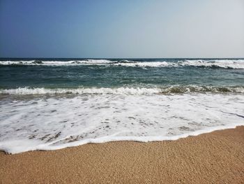 Scenic view of beach against clear sky