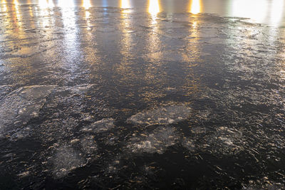 Close-up of reflection on beach