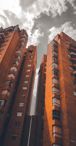 Low angle view of modern buildings against sky