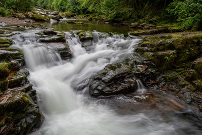 Long exposure of the waterfall at watersmeet bridge pool at watersmeet in devon