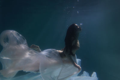 Woman swimming in sea