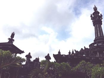 Low angle view of statue against sky