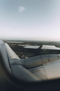 Close-up of airplane flying over sea
