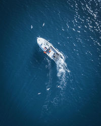 Aerial view of boat sailing in sea