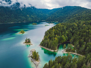 Scenic view of lake and mountains against sky