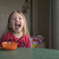 Portrait of happy woman at home