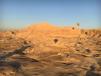 Scenic view of desert against clear sky