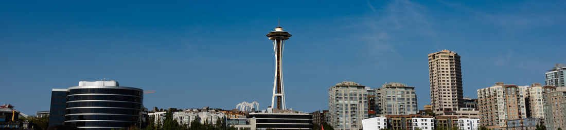 Low angle view of buildings against blue sky