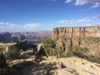 Rock formations on landscape against sky