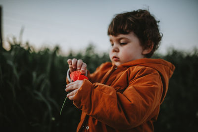 Boy standing on field