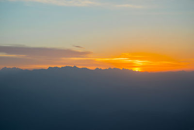 Scenic view of silhouette mountains against sky during sunset