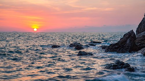 Scenic view of sea against sky during sunset