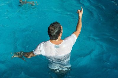 High angle view of man swimming in pool