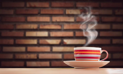 Close-up of coffee cup on table