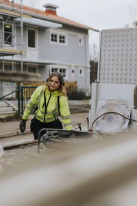Young female road worker at work
