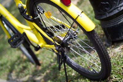 Close-up of yellow bicycle