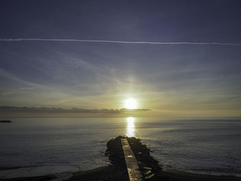 Scenic view of sea against sky during sunset