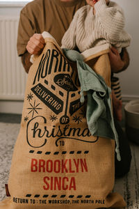 High angle view of woman lying on bed at home