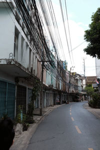 Road by city against sky