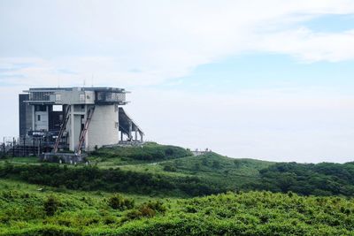 Built structure on land against sky