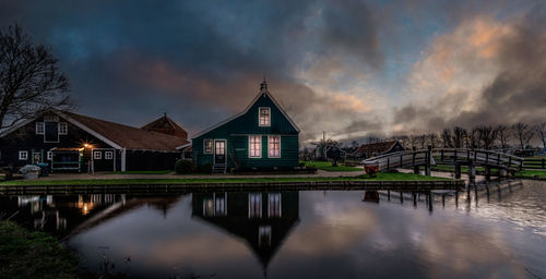 Panoramic view of lake by buildings against sky