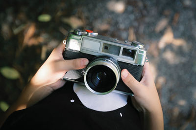 Boy hand holding a beautiful vintage camera