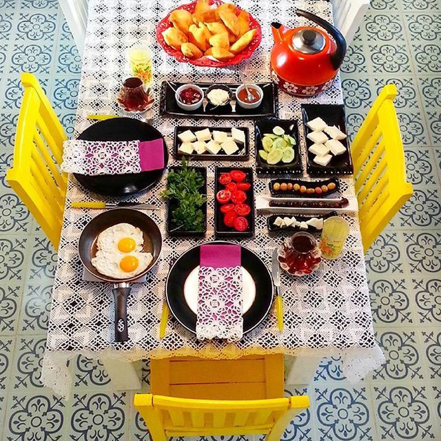 indoors, food and drink, high angle view, table, still life, yellow, drink, freshness, food, refreshment, multi colored, plate, directly above, variation, tablecloth, drinking glass, fruit, bowl, healthy eating, ready-to-eat