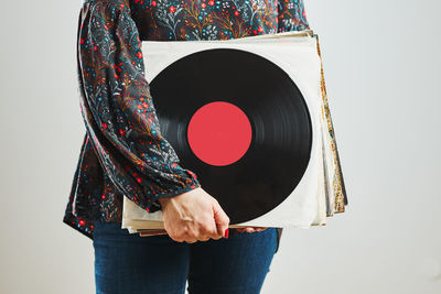 Woman holding vinyl records. music passion. listening to music from analog record. retro music. dj