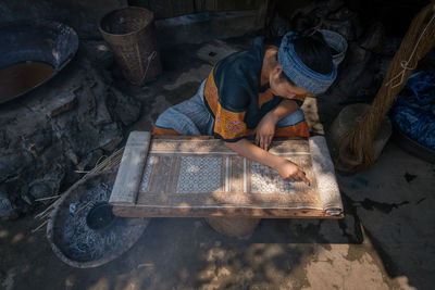 High angle view of man working in factory