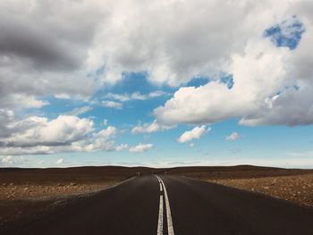 Empty road against sky